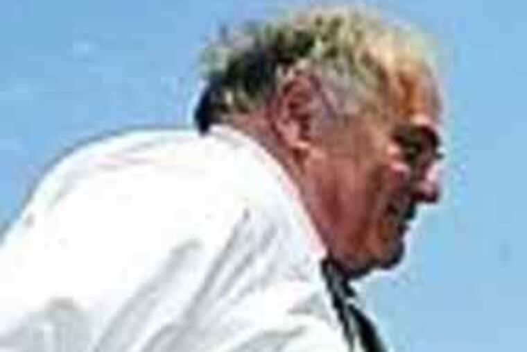 A hefty Rendell (left) boards plane in Erie on June 16. And (right) as he looked at Eagles post-game show on Comcast Sunday.