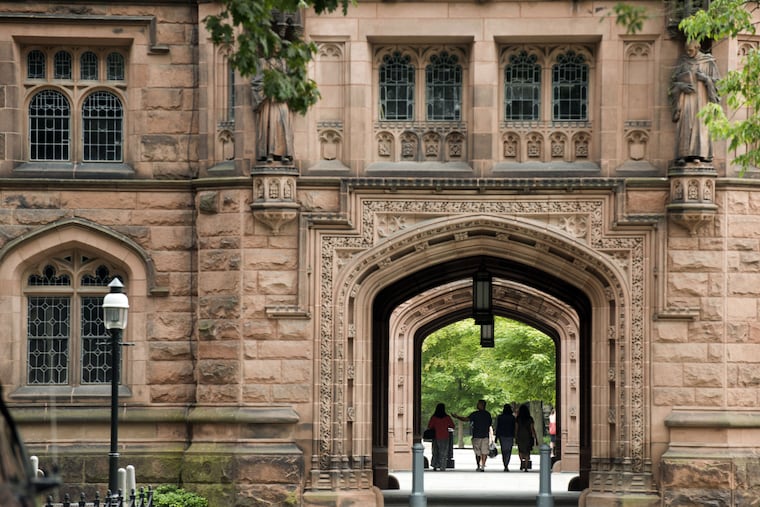 In a file photo, people walk on the Princeton University campus in Princeton, N.J.
