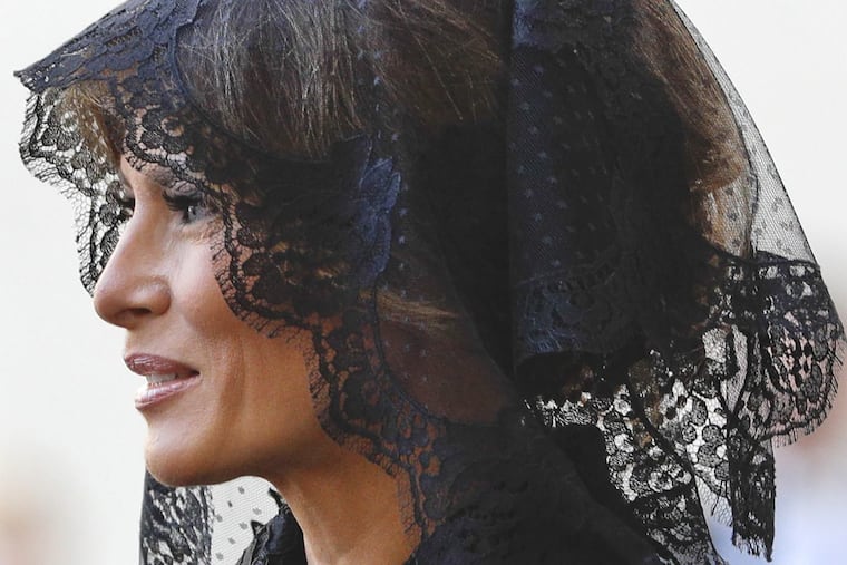 First lady Melania Trump arrives at the San Damaso courtyard ahead of her husband President Donald Trump. (AP Photo/Gregorio Borgia)