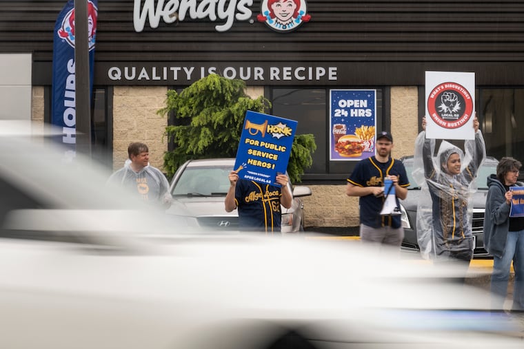 Demonstrators rally in support of unions, federal workers and workers rights in Northeast Philadelphia on Saturday, April 26, 2025.