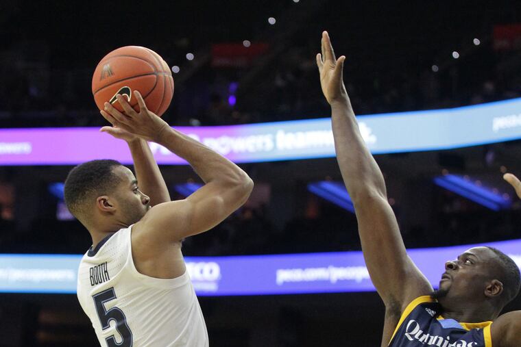 Phil Booth, left, of Villanova shoots over Kevin Mato of Quinnipiac during the 1st half at the Wells Fargo Center on Nov. 10, 2018. CHARLES FOX / Staff Photographer