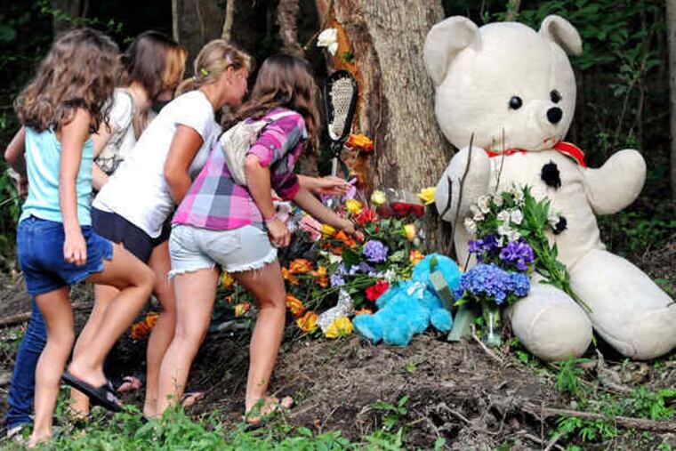 Friends build a memorial where Montgomery Alexander Duguay Wood crashed his car in Honey Brook Township, Chester County, killing himself and a passenger.
