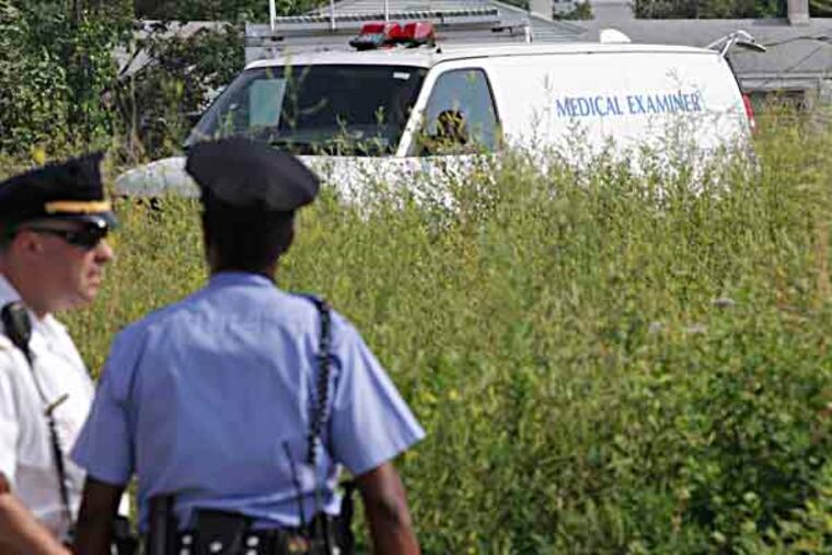 Near York and Sedgley Cops found chopped up body parts in a grassy field in Strawberry Mansion Friday, July 19, 2013. (Steven M. Falk / Staff Photographer )