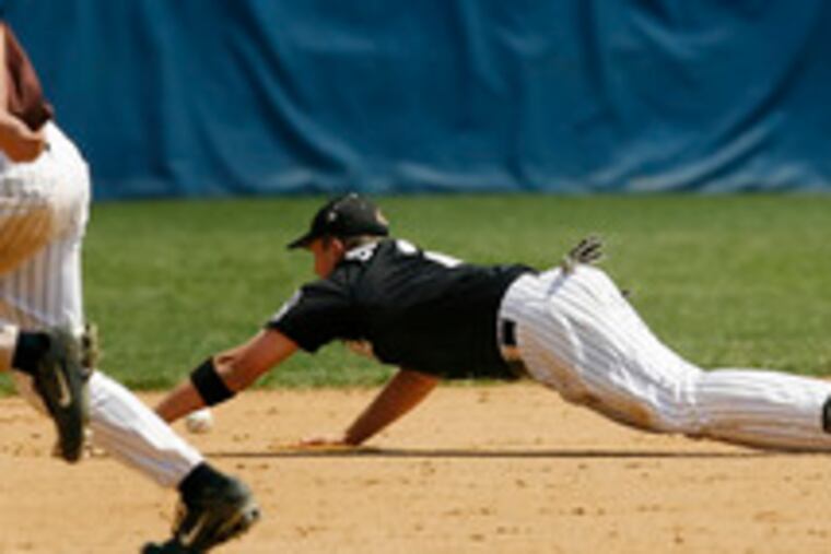 dives but cannot get to a hit by Cherokee's Nick Allen, who had three hits and 7 RBIs.