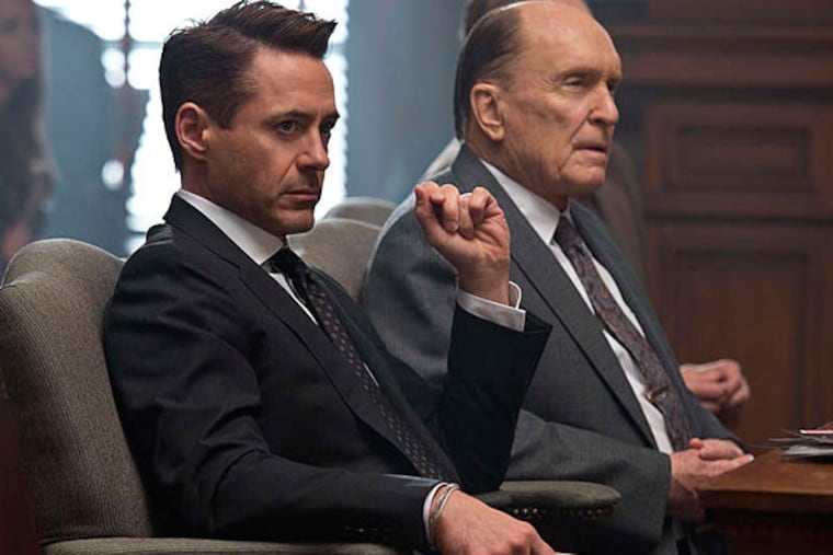 Robert Downey Jr. (left) is a lawyer and Robert Duvall is his father - and the defendant - in "The Judge." (Warner Bros. Pictures)