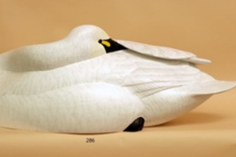 Expected to sell for $1,600 to $2,200 is a rare figure ofa sleeping swan, carved by Bob Kerr of Smiths Falls, Ontario.