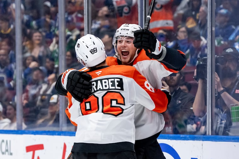 Tyson Foerster celebrates his goal with Joel Farabee during the Flyers' game against the Canucks on Friday night.