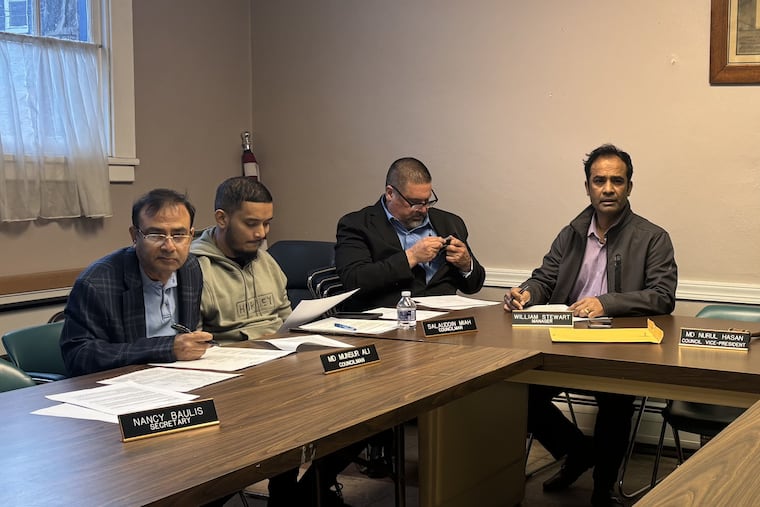 Millbourne councilmembers Md Munsur Ali, Salauddin Miah and Md Nurul Hasan sit alongside borough manager William Stewart at an April 15 council meeting. Ali and Hasan pleaded guilty to election crimes but have refused to step down.