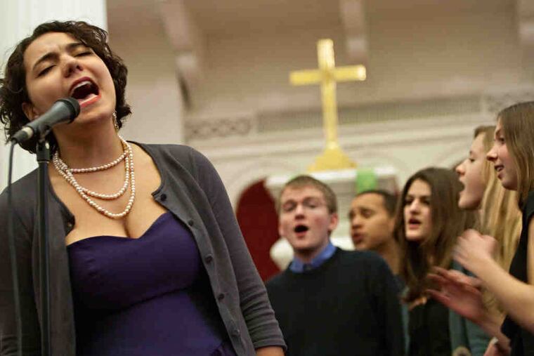 Lauren Ballester solos on "Valerie" during a performance by the Germantown Friends School A Cappella Choir.