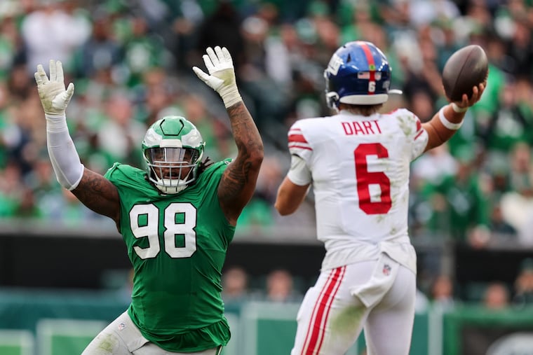 Eagles defensive tackle Jalen Carter puts pressure on New York Giants quarterback Jaxson Dart during the third quarter Sunday.