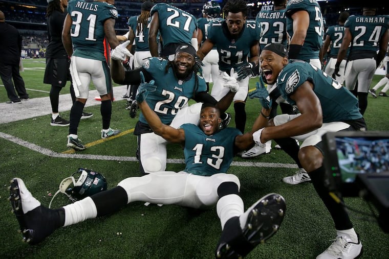 Eagles left to right: LeGarrette Blount, Nelson Agholor, Patrick Robinson, and Rasul Douglas pose on the sideline as the Philadelphia Eagles win 37-9 over the Dallas Cowboys in Arlington, Texas on November 19, 2017.