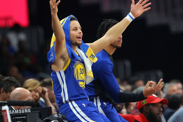Golden State Warriors guard Stephen Curry (30) reacts from the sideline during the first half of an NBA basketball game Monday, Dec. 3, 2018, in Atlanta. Golden State won 128-111. (AP Photo/John Bazemore)