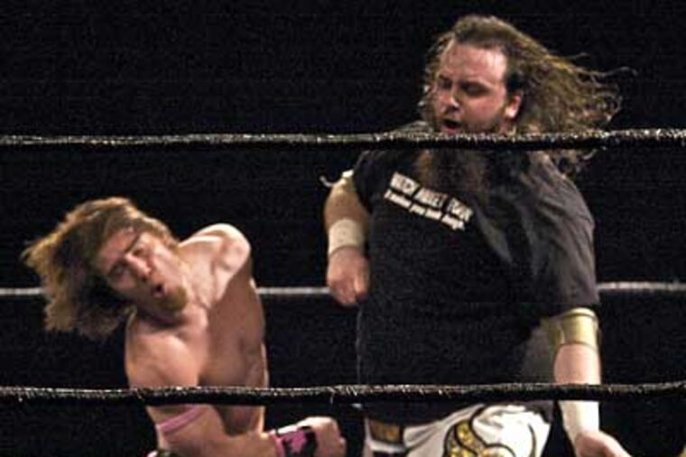 Wrestlers go at each other in the ring in the Arena. Oscar nominee Mickey Rourke filmed several of his scenes for "The Wrestler" at the venue. (John Costello / Staff Photographer)