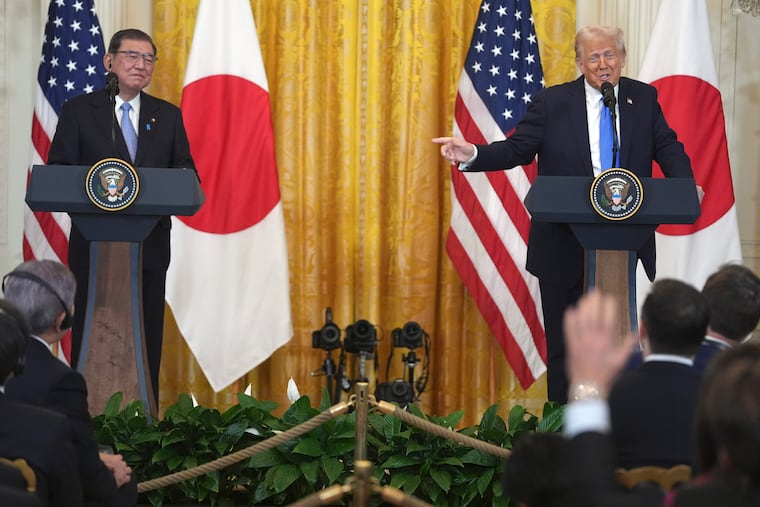 President Donald Trump answers questions during a news conference with Japan's Prime Minister Shigeru Ishiba at the White House on Friday in Washington.