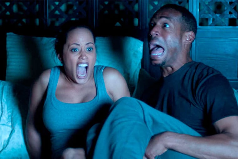 Marlon Wayans , seen here with "A Haunted House" co-star Essence Atkins, starred in, wrote and produced his latest parody movie.