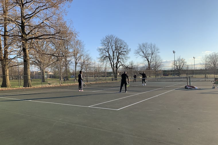 Coronavirus fears didn't keep tennis players off Fairmount Park courts in Stawberry Mansion on Sunday, March 15.