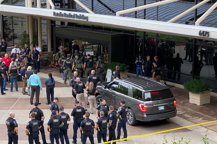Emergency personnel respond to a shooting at the Natalie Medical Building on Wednesday in Tulsa, Okla.