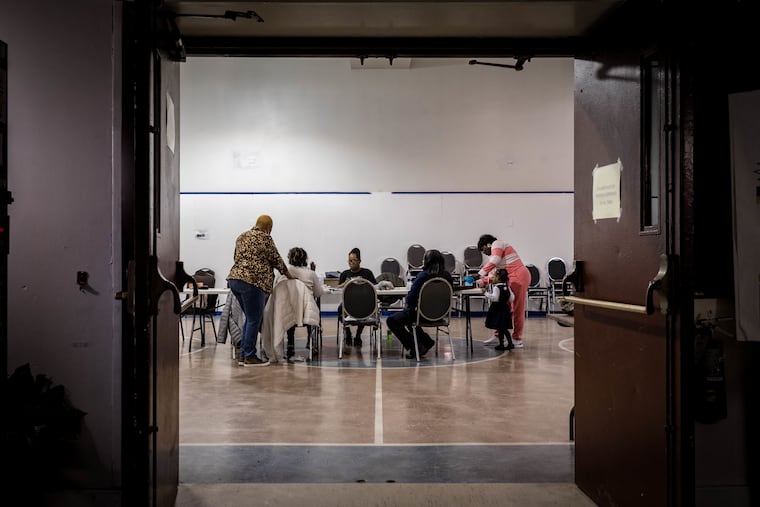 A group of mothers gather at the Dixon House in South Philadelphia to put together submissions for the Gun Violence Memorial Project. Diversified Community Services, which runs the site, will also operate an evening resource center for youth starting in December.