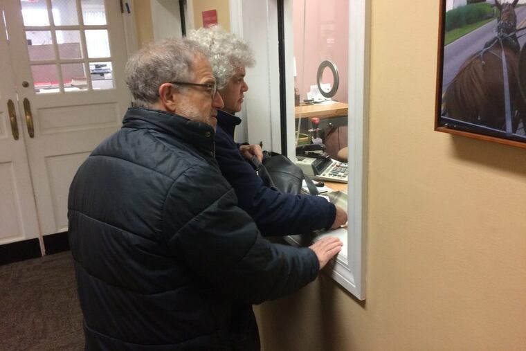 Gail Trachtenberg and Lewis Eron prepay part of their 2018 property tax bill at the township building in Cherry Hill, New Jersey, on Thursday, Dec. 22, 2017. People across the country have been trying to prepay property taxes before a federal tax overhaul kicks in and caps deductions for state and local taxes. (AP Photo/Geoff Mulvihill)