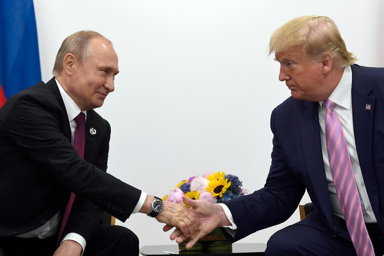 Donald Trump shakes hands with Russian President Vladimir Putin during a bilateral meeting on the sidelines of the G-20 summit in Osaka, Japan, in 2019.