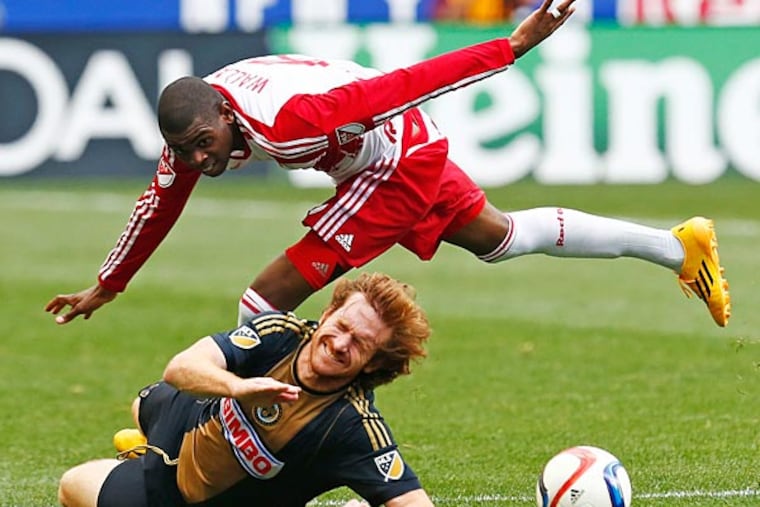 Philadelphia Union forward Fernando Aristeguieta (bottom) and New York Red Bulls defender Anthony Wallace (top) fight for the ball during a quarterfinal match of the US Open Cup at Red Bull Arena. (Saed Hindash/NJ Advance Media for NJ.com via USA Today)