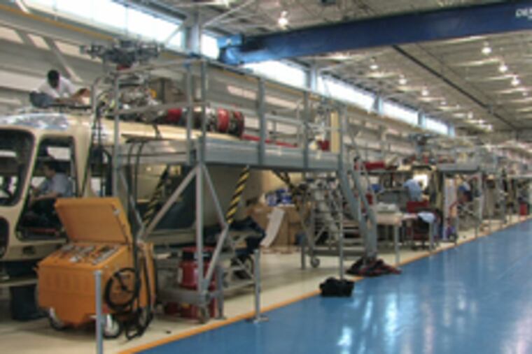 With the AgustaWestland expansion, above, the workforce is expected to reach 500, up from 200 in 2005. At right, helicopter pioneer Frank Piasecki (in wheelchair) toured Boeing's hangar at New Castle County Airport in October. Piasecki died last week.