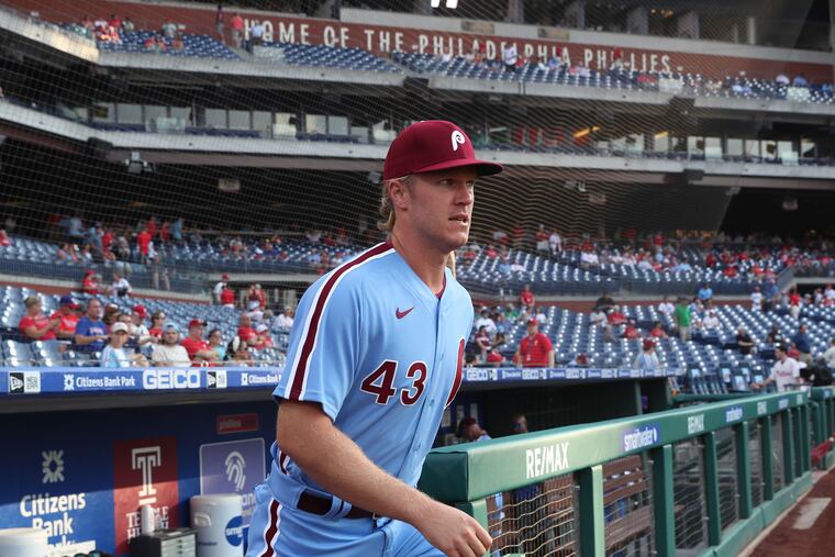 New Phillies pitcher Noah Syndergaard walks to the bullpen to warm up before his first start with his new team on Thursday.