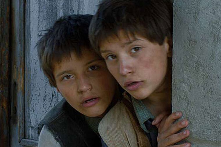 Twins László Gyémánt and András Gyémánt portray brothers who embark on a shocking program of self-conditioning. (Sony Pictures Classics)