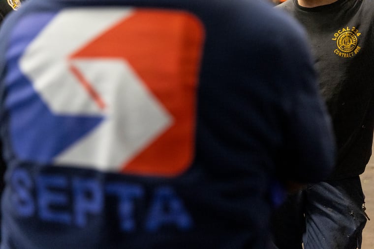 Brian Pollitt, President of TWU Local 234, talks with some Autobody Mechanics with SEPTA to check in on how they’re doing at the Callowhill Depot in West Philadelphia in July.