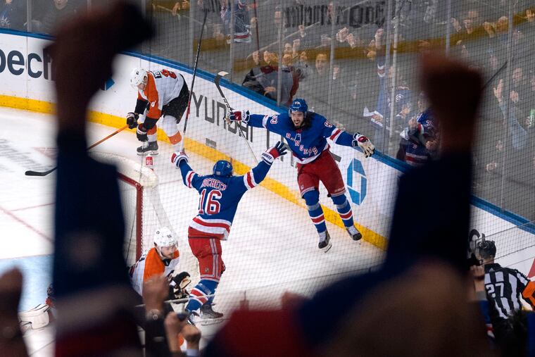 The Rangers' Vincent Trocheck (16) and Mika Zibanejad celebrate Trocheck's third-period goal.