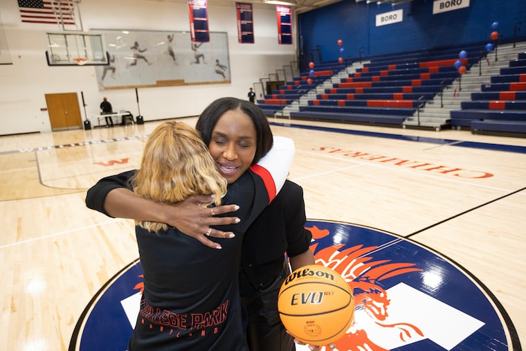 Willingboro High School renamed its renovated gym the Crystal Langhorne Gymnasium. Langhorne scored 2600 points as a high schooler. She went on to lead the University of Maryland and her WNBA teams to championships. Crystal (right) is hugged by her college coach, Brenda Frese of the University of Maryland, on Dec. 13, 2023.