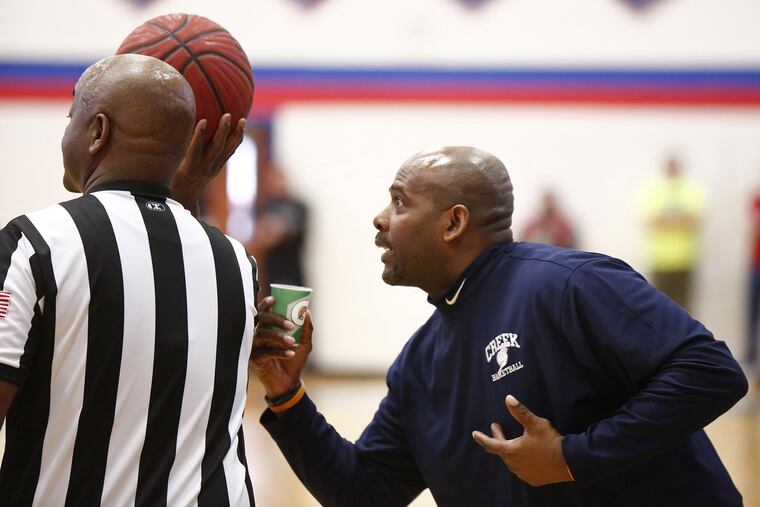 Thinking he was about to get a technical foul for storming away from the bench, Timber Creek coach Rich Bolds tells the referee that he was merely getting a drink from the water cooler during the second quarter of a South Jersey Group 3 boys' basketball semifinal Saturday, March 4, 2017 at Triton. No technical was issued, and Timber Creek went on to win, 64-51.