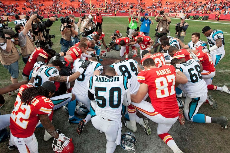 After Sunday's game ended, Chiefs and Panthers players gathered at midfield to pray for K.C. linebacker Jovan Belcher, his girlfriend, and their families. JOHN SLEEZER / Kansas City Star