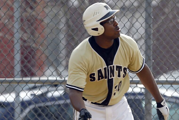 Neumann-Goretti High's Jose Ockimey watches his first-inning home run
against West Catholic High during Catholic League baseball action.