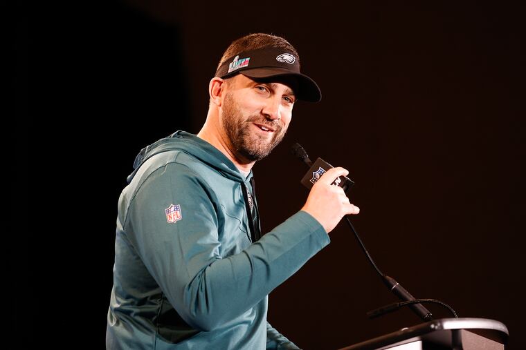 Eagles coach Nick Sirianni smiles while answering questions during team availability on Wednesday in Phoenix.