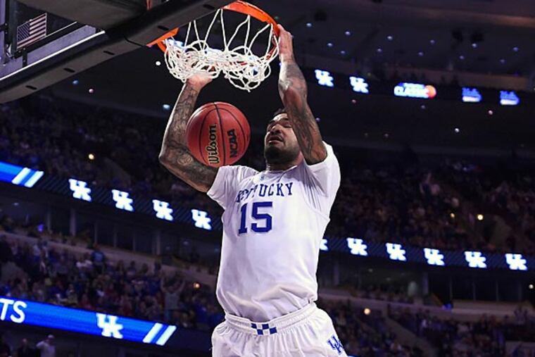 Kentucky Wildcats forward Willie Cauley-Stein (15) dunks the ball against the UCLA Bruins during the first half at United Center. (Mike DiNovo/USA Today)