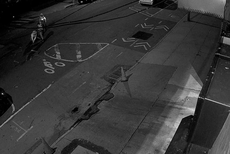 Surveillance footage shows three people removing a manhole and climbing down a sewer in New York City on May 5.