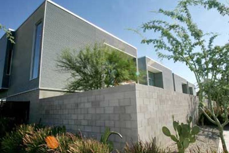 Town homes at "Galleries at Turney" are seen Wednesday in Phoenix. The ultramodern town homes are selling despite a slow housing market because of their energy efficiency and green construction. (AP Photo/Matt York)