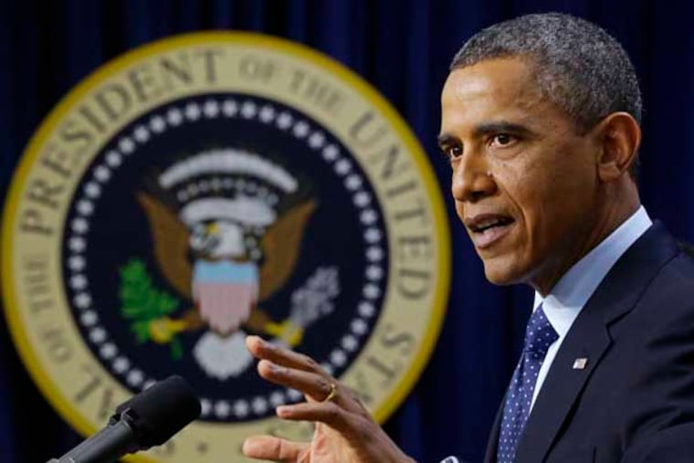 President Barack Obama gestures as he speaks about the fiscal cliff, Monday, Dec. 31, 2012, in the South Court Auditorium at the White House in Washington. The president said it appears that an agreement to avoid the fiscal cliff is "in sight," but says it's not yet complete and work continues. (AP Photo/Charles Dharapak)