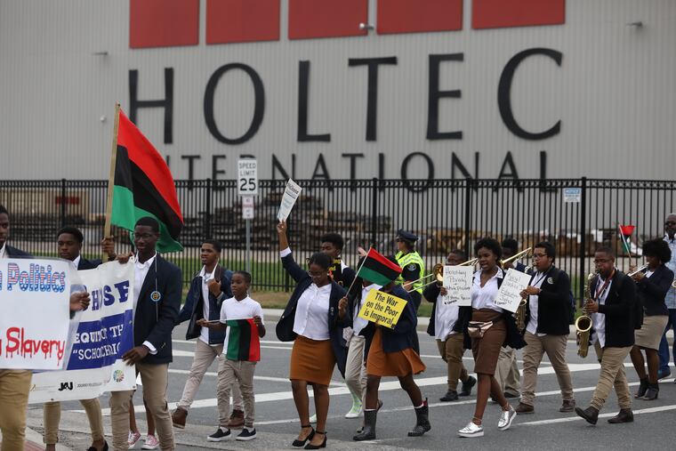 Protester in front of Holtec International in Camden Friday September 14, 2018.