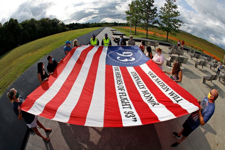 Visitors to the Flight 93 National Memorial in Shanksville, Pa., participate in a memorial service on Thursday, Sept. 10, 2020, as the nation prepares to mark the 19th anniversary of the Sept. 11, 2001 attacks.