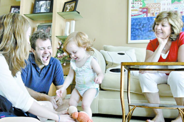 The simple joys of family are shared in the condo by Dina Wizmur and her husband, Teddy Gleser, with their 16-month-old daughter, Maya, and Dina's mother, Judith Wizmur. (Elizabeth Robertson / Staff Photographer)