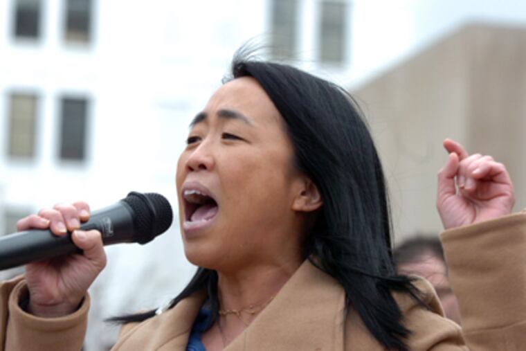 Helen Gym, founder of Parents United for Public Education, speaks at
a rally outside the School District of Philadelphia. (Sarah J. Glover / Staff Photographer)