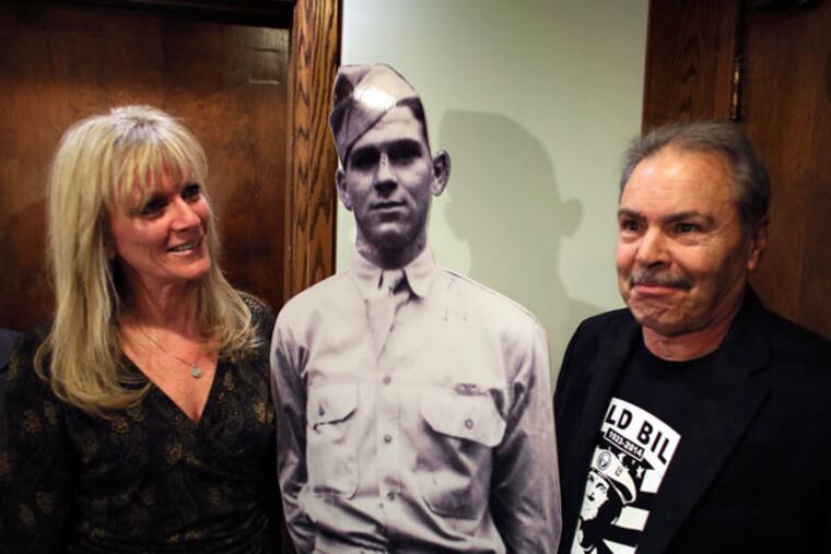 William "Wild Bill" Guarnere's son Gene and granddaughter Debi Rafferty pose with a life-sized photo of "Wild Bill" during a beef-and-beer fundraiser Friday, Feb. 6, 2015, at Canstatters Volksfest-Verein in Northeast Philadelphia to raise money for a statue. (For the Inquirer/ Joseph Kaczmarek)