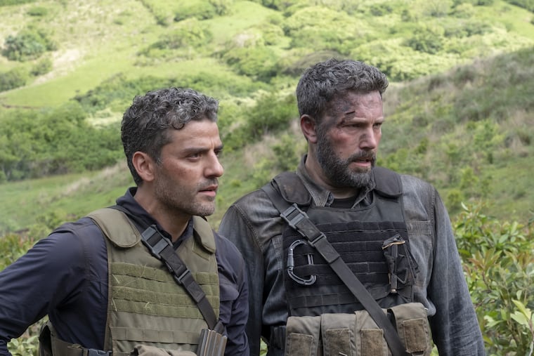 Oscar Isaac (left) and Ben Affleck in "Triple Frontier."