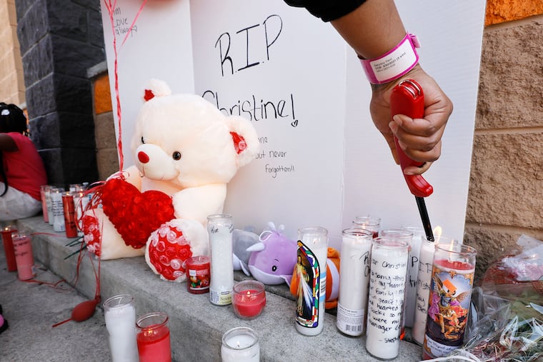 Friends and co-workers at the Dunkin' Donuts, 532 W Lehigh Ave. in Phila. grieve after their manager, Christine Lugo, was shot in the head and killed in an apparent robbery on June 5. Police have issued an arrest warrant for Keith Gibson, who is being investigated in connection with at least five other homicides in Philadelphia and Delaware.