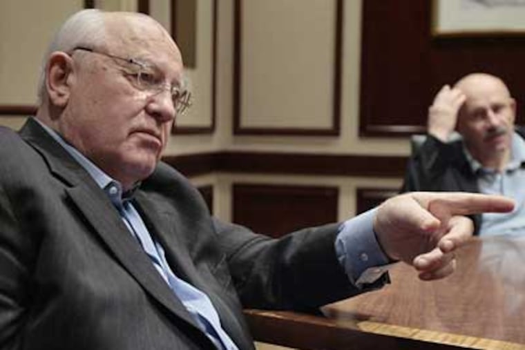 Mikhail Gorbachev answers questions through his interpreter Pavel Palazhchenko (right) at The Rittenhouse Hotel. Gorbachev will receive the Liberty Medal today. (Elizabeth Robertson / Inquirer)