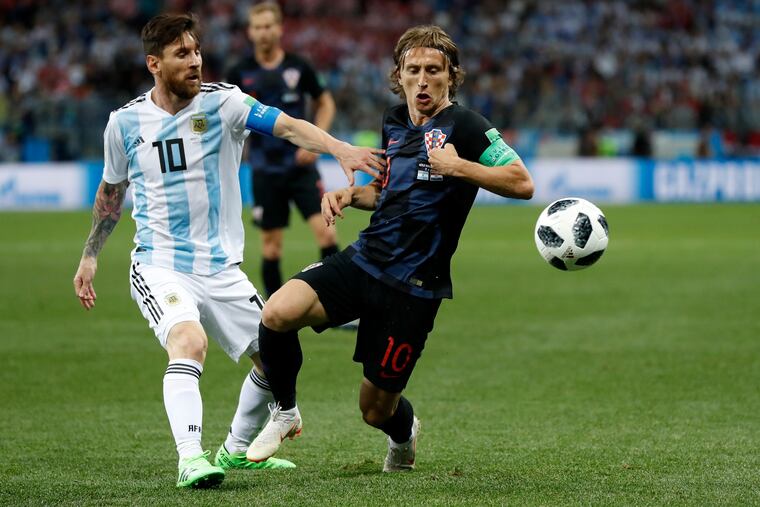 Argentina's Lionel Messi, left, and Croatia's Luka Modric fighting for the ball during the 2018 World Cup.