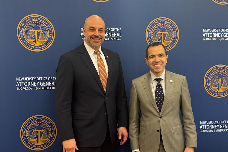 Pennsylvania Attorney General Dave Sunday (left) poses for a photo with New Jersey Attorney General Matt Platkin following an event on Dec. 17 about first responders' mental health.