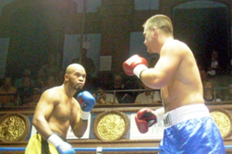 Levon Warner (left) faces Joey "Minnesota Ice" Able at the Blue Horizon last Sept. 7. Warner is charged in Liczbinksi's death.